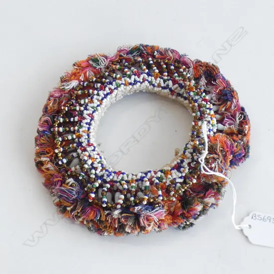 A bead and tassel pot holder ring, purchased on Amber Road In Jaipur, 1994.